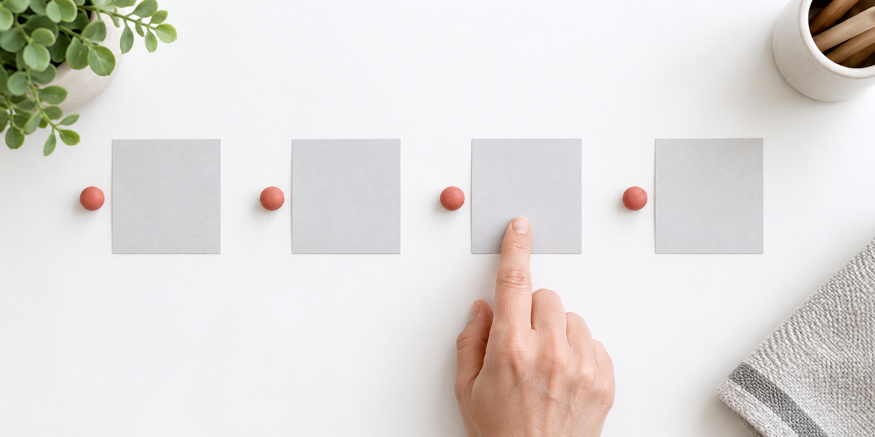 Four blank cards and small coral markers arranged as a one-beat-at-a-time path