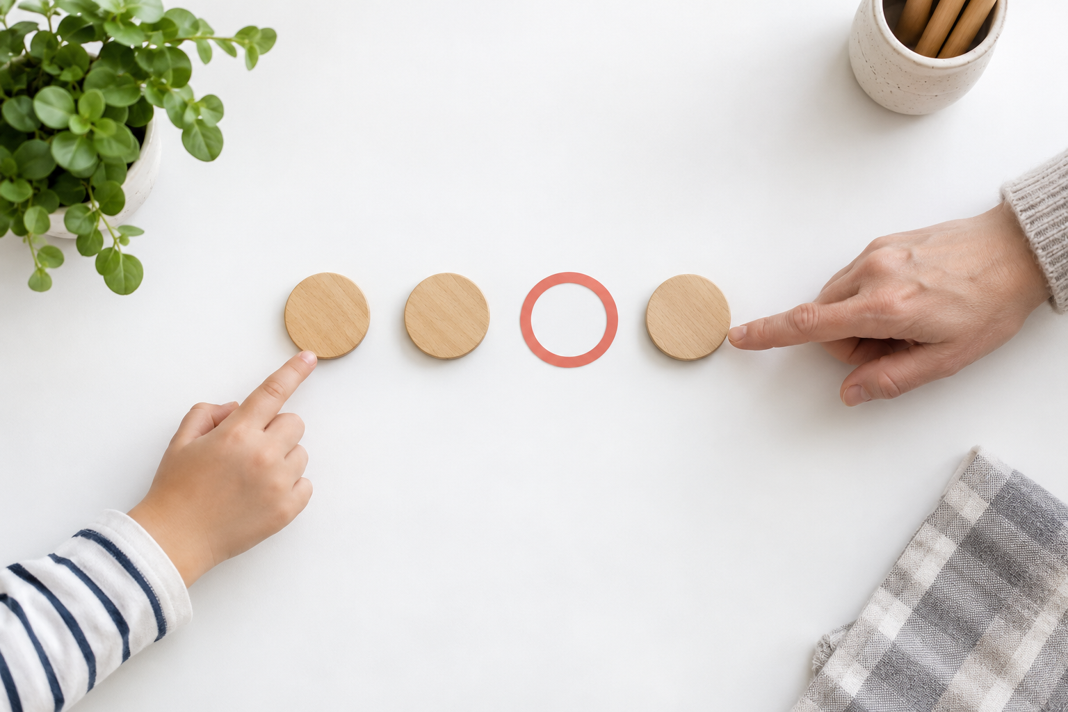 Adult and child hands point to a row of beat tokens with one coral circle marking a silent beat
